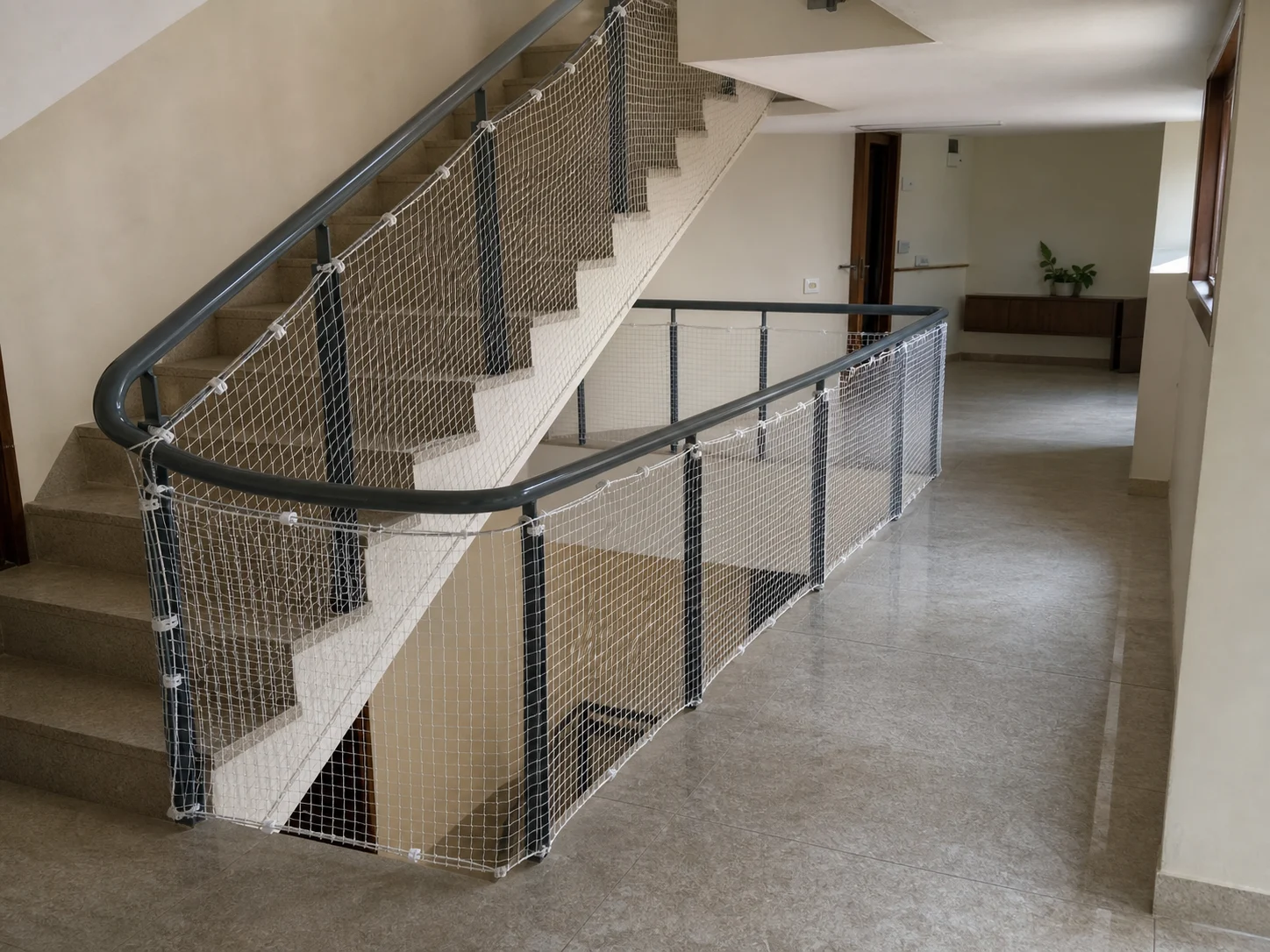 Safety net fitted continuously around a residential stair landing void